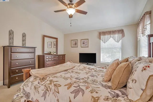 a bedroom with a bed and a fireplace