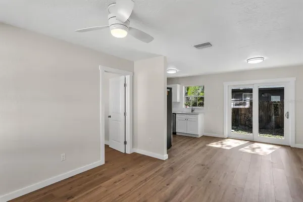 wooden floor in an empty room with a window
