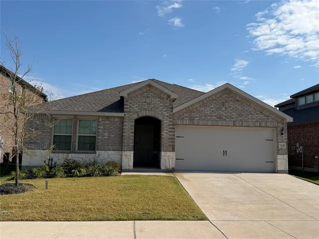 a view of garage and yard