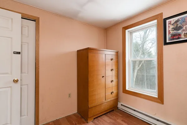 a view of an entryway with wooden floor