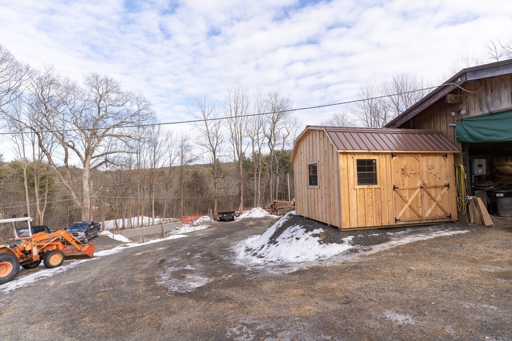116 B Spencer Road Oakham, MA 01068 - Photo 8 of 22 a view of a car park in front of house