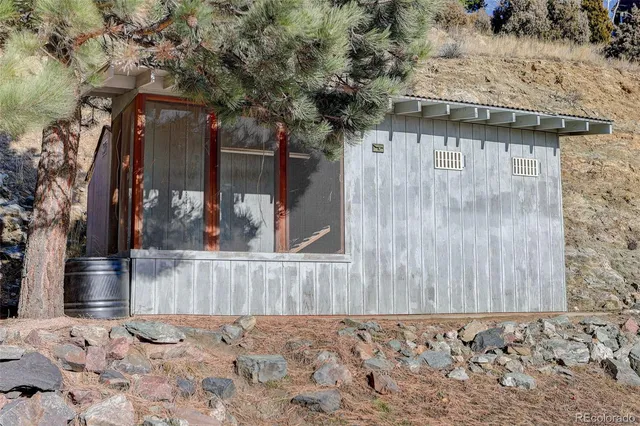 a view of a balcony with wooden floor and fence