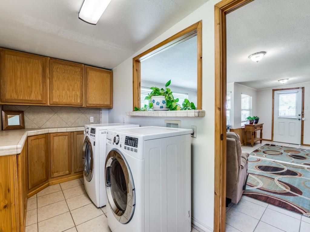 111 County Road 2806 Mabank, TX 75147 - Photo 13 of 40 a view of a kitchen with washer and dryer