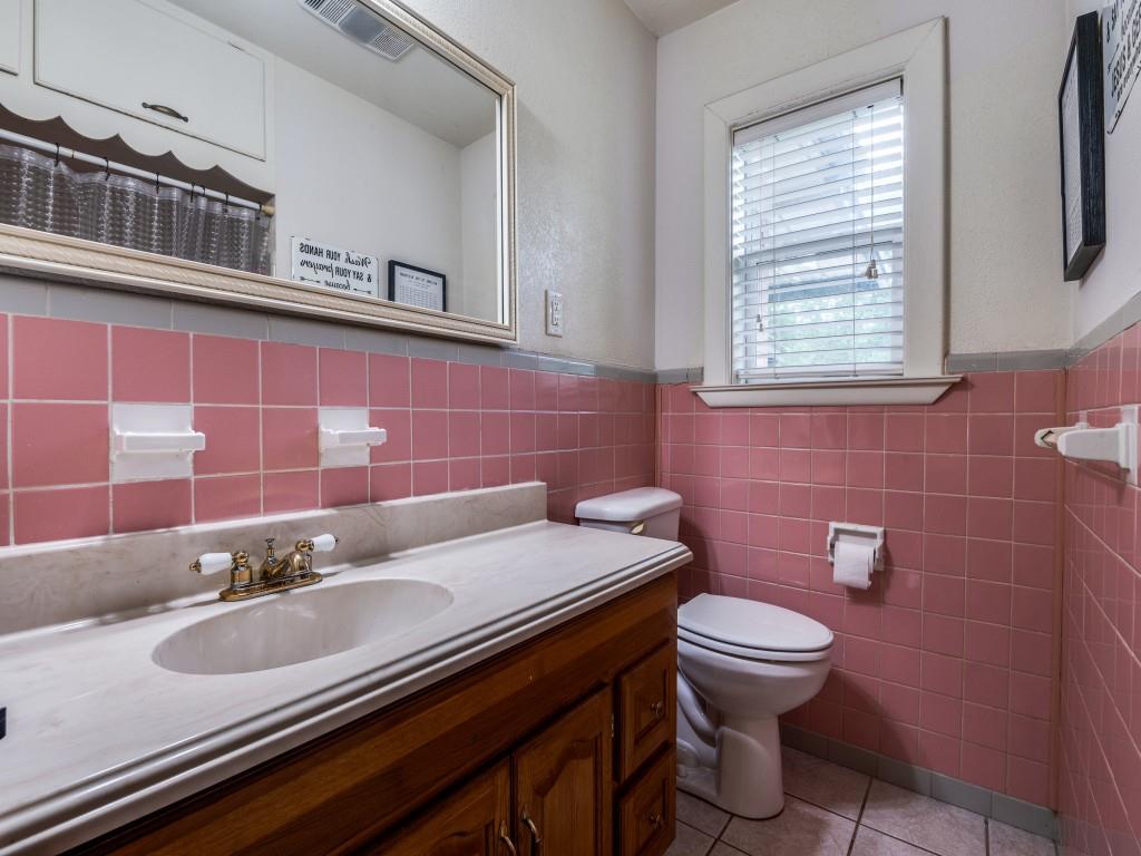 111 County Road 2806 Mabank, TX 75147 - Photo 14 of 40 a bathroom with a sink and a toilet