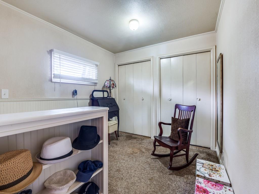111 County Road 2806 Mabank, TX 75147 - Photo 15 of 40 a room with a chair and a mirror