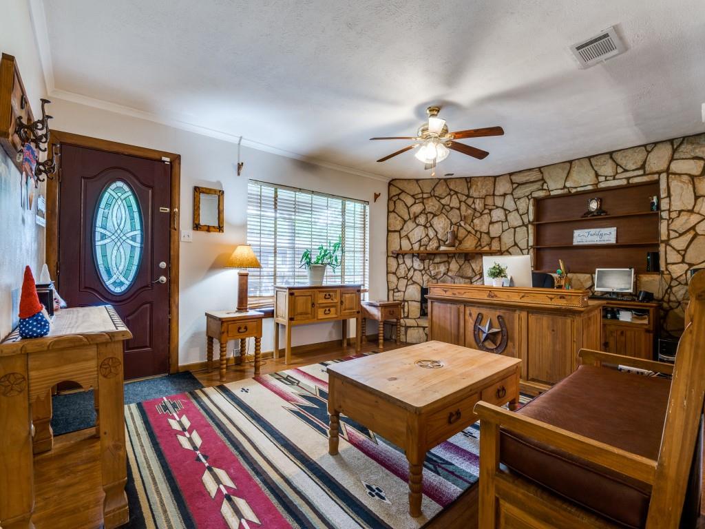 111 County Road 2806 Mabank, TX 75147 - Photo 25 of 40 a living room with furniture a rug and a chandelier