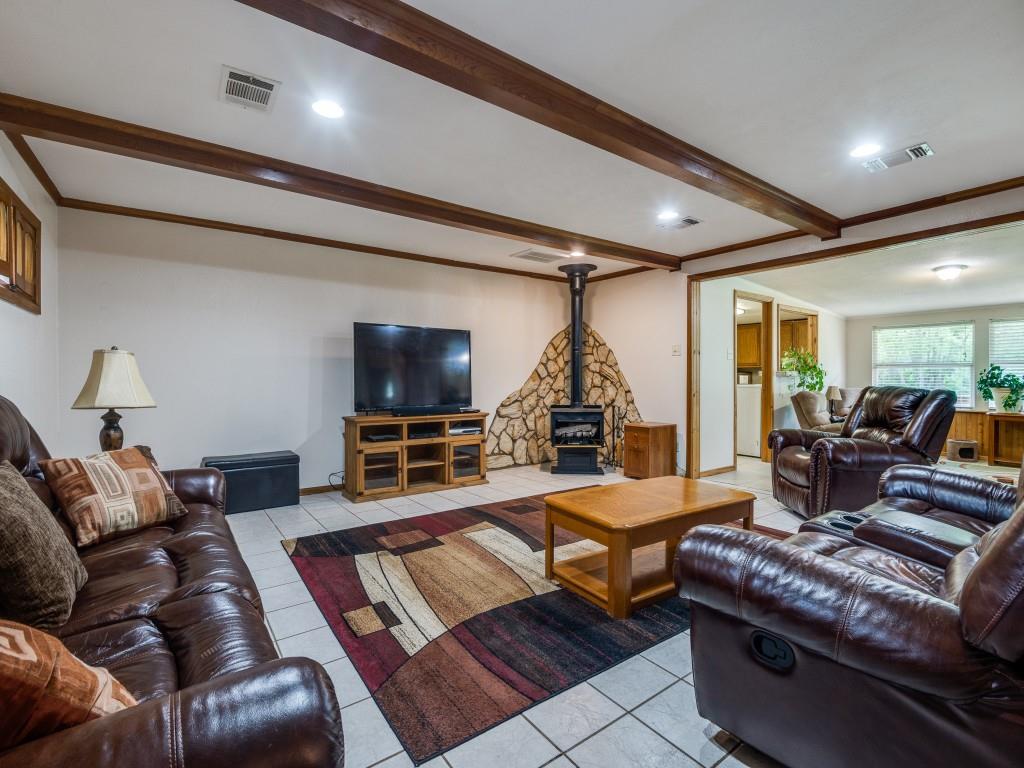111 County Road 2806 Mabank, TX 75147 - Photo 29 of 40 a living room with furniture and a flat screen tv