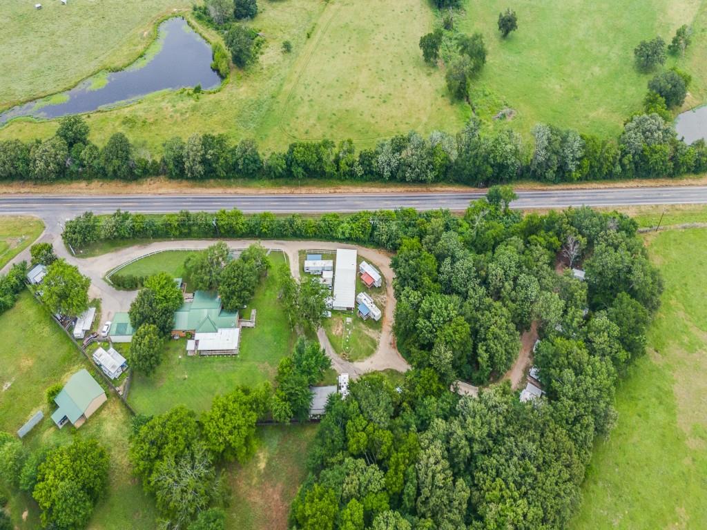 111 County Road 2806 Mabank, TX 75147 - Photo 3 of 40 an aerial view of a house with a garden and trees