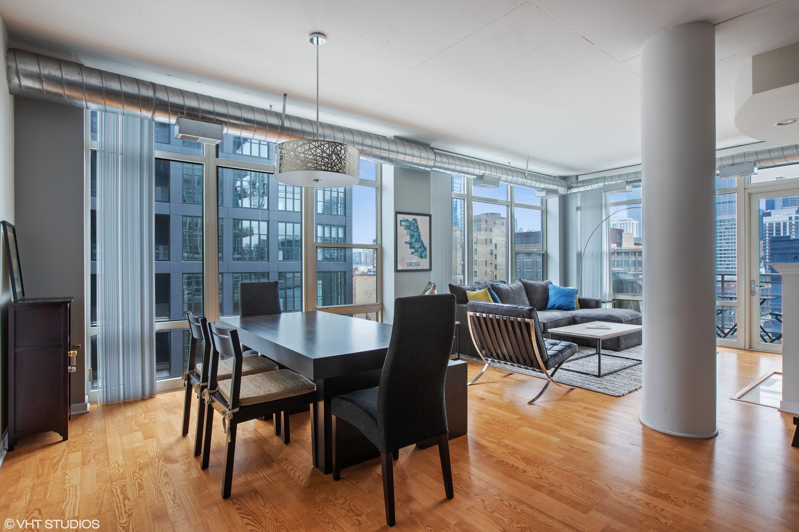 909 West Washington Boulevard, Unit 513 Chicago, IL 60607 - Photo 3 of 16 a view of a dining room with furniture window and wooden floor
