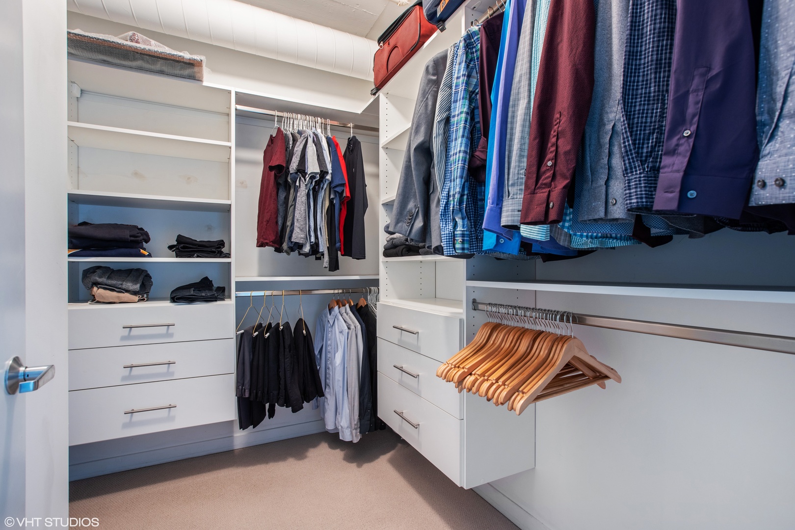 909 West Washington Boulevard, Unit 513 Chicago, IL 60607 - Photo 7 of 16 a view of walk in closet with clothes and shoes