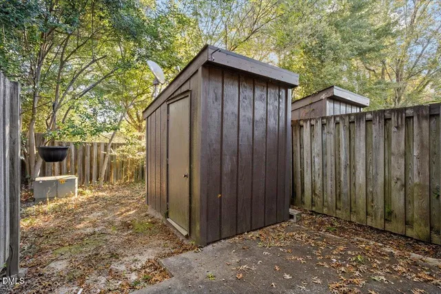 a view of a brick house with a large window