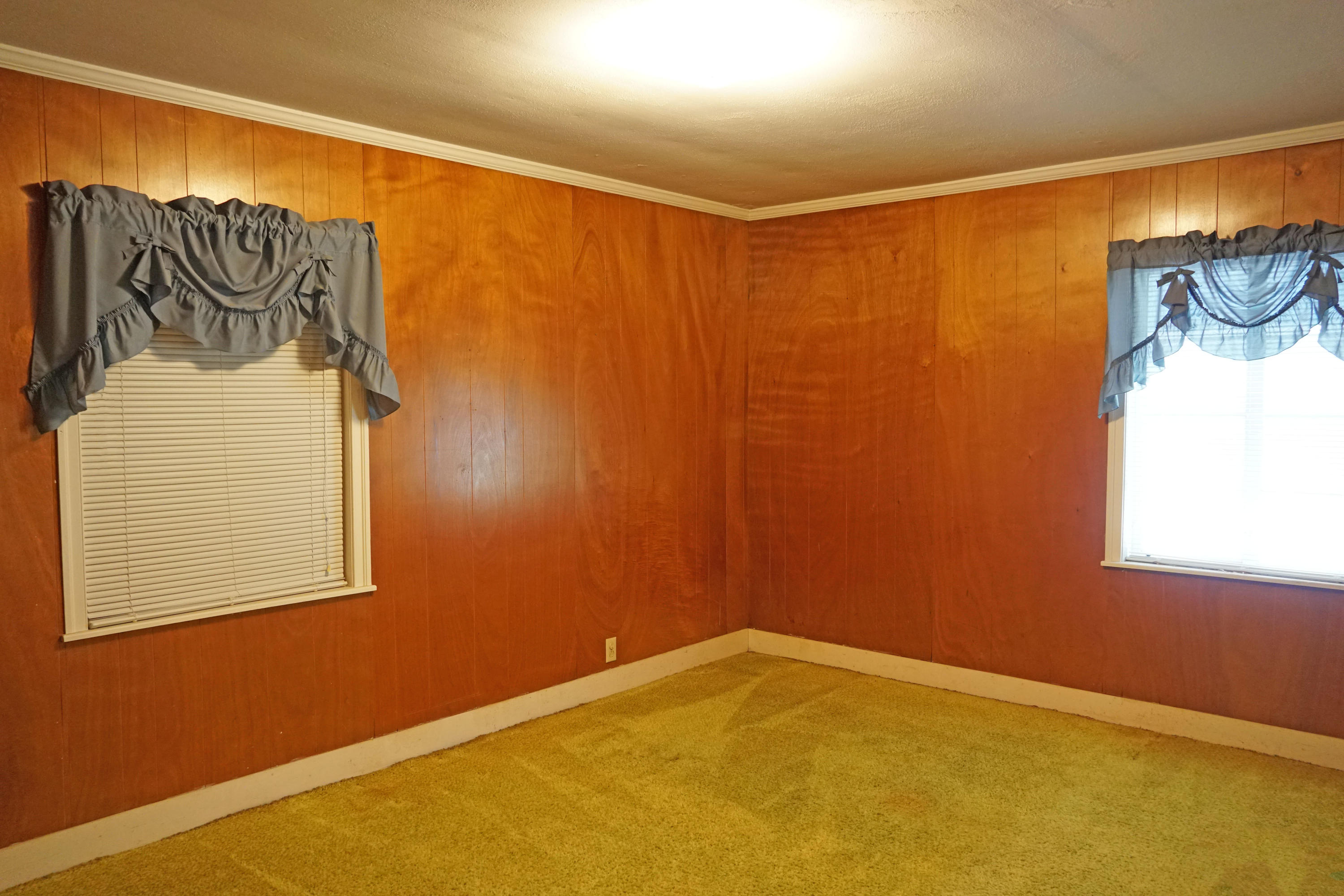 595 Dantzler Street Elloree, SC 29047 - Photo 21 of 36 D guest bedroom with blue window treatme