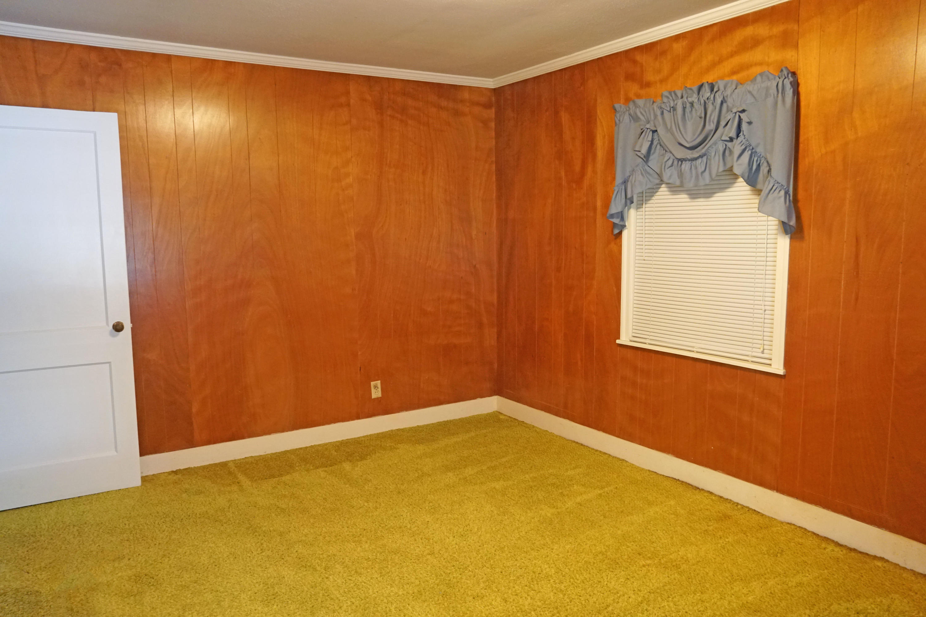 595 Dantzler Street Elloree, SC 29047 - Photo 22 of 36 D guest bedroom with blue window treatme