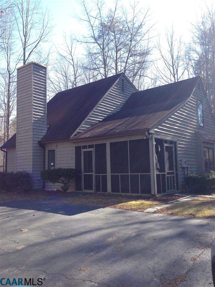 38 Colonial Road Palmyra, VA 22963 - Photo 1 of 8 a front view of a house with a yard and garage