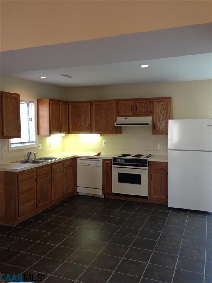 38 Colonial Road Palmyra, VA 22963 - Photo 3 of 8 a kitchen with a sink a stove and cabinets