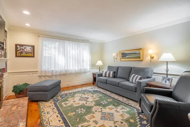 a living room with a couch and a window