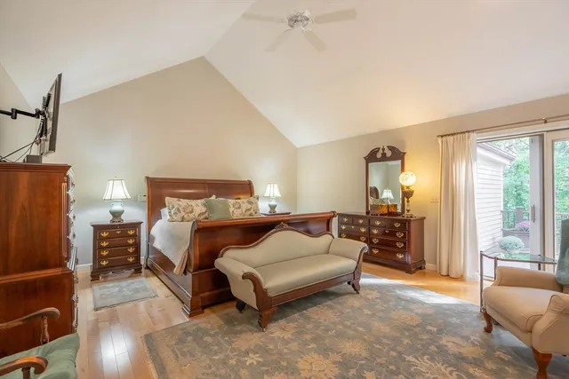 a spacious bedroom with a bed and a couch