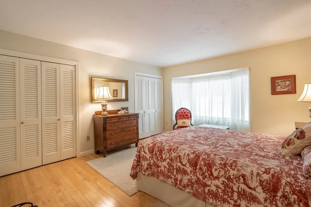 a bedroom with a large bed and a dresser