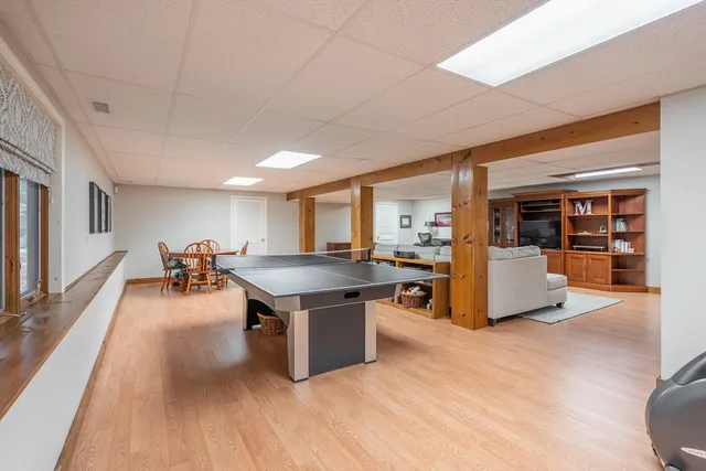 a room with lots of furniture and a wooden floors