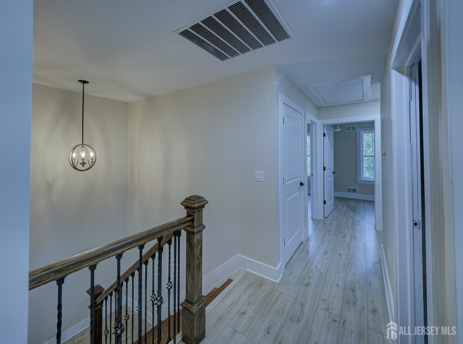 8 Travers Avenue, Unit 1 Edison, NJ 08817 - Photo 11 of 19 a view of a hallway with wooden floor