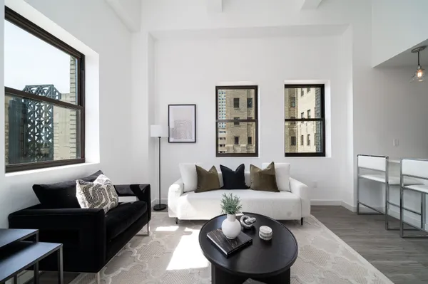 a living room with furniture and a large window