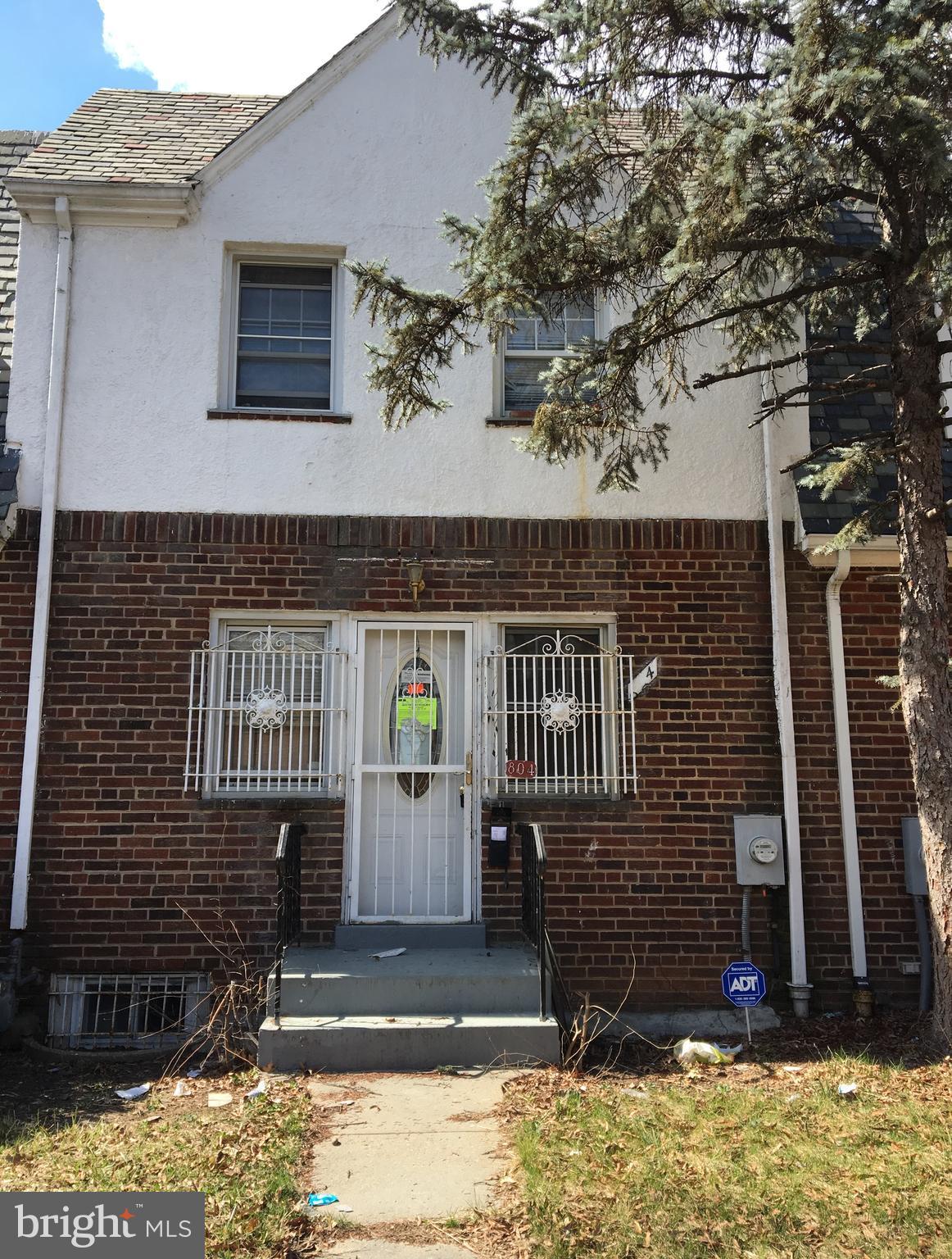 a front view of a house with parking