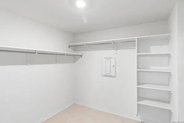 a view of an empty walk in closet