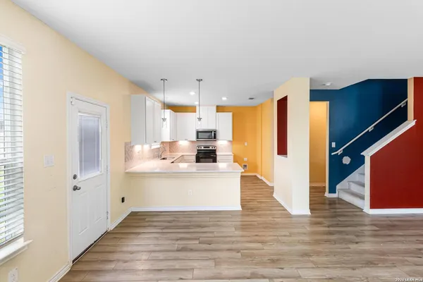 a view of kitchen with wooden floor