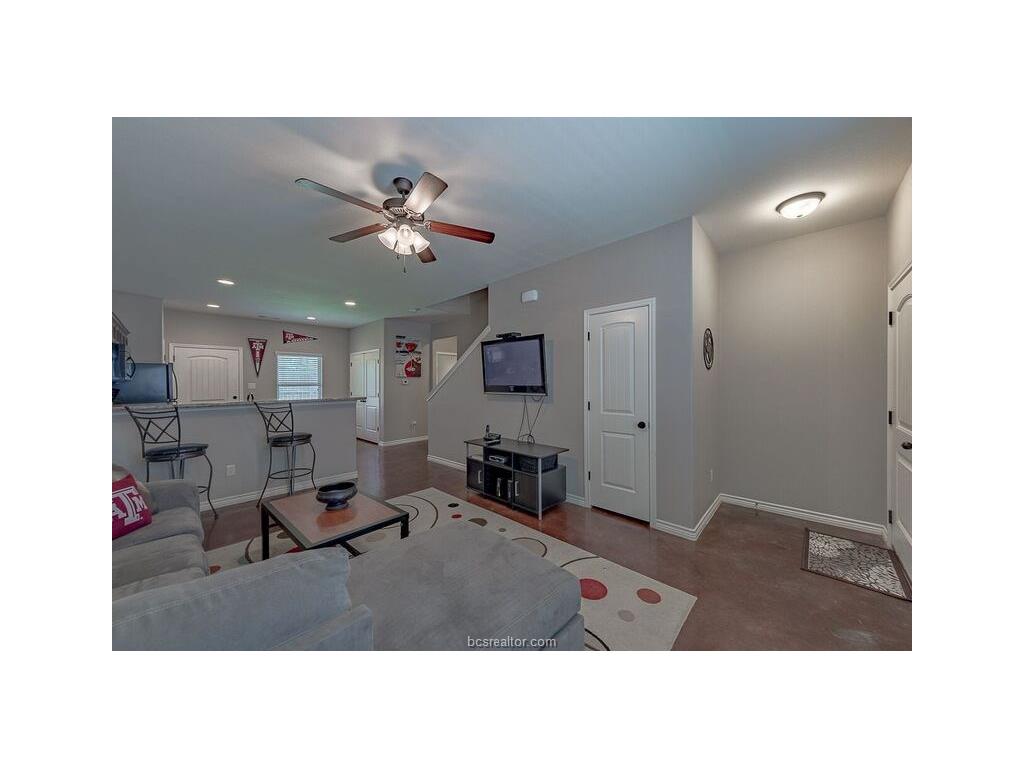 131 Watson Lane Bryan, TX 77801 - Photo 3 of 20 Living room featuring ceiling fan