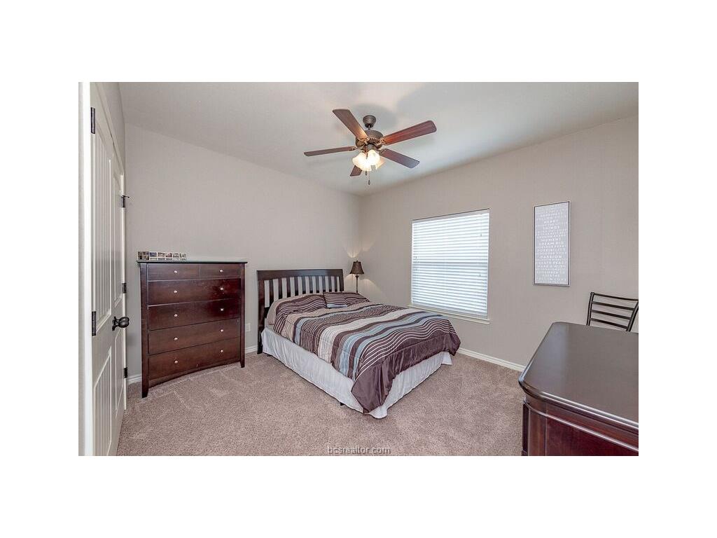 131 Watson Lane Bryan, TX 77801 - Photo 9 of 20 Bedroom featuring light colored carpet and ceiling fan