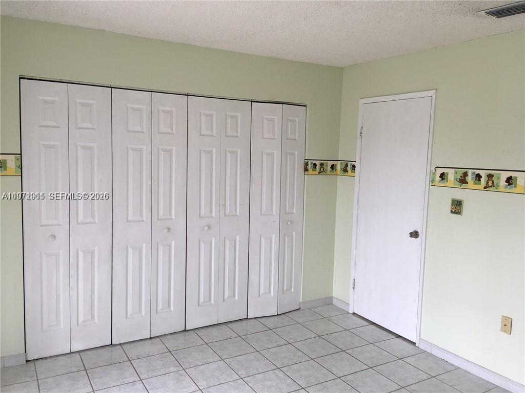 2162 West 60th Street, Unit 14208 Hialeah, FL 33016 - Photo 6 of 10 a view of a closet area with natural light