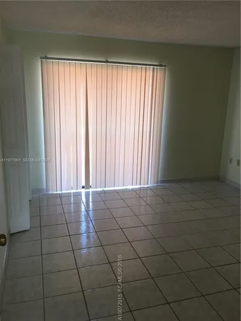 a bathroom with a toilet and bathtub