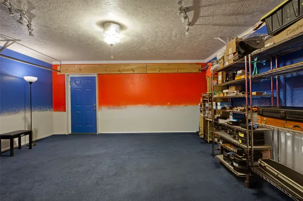 a view of an empty room with a bookshelf