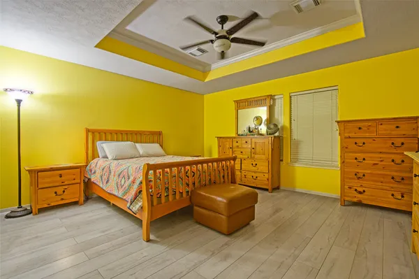 a bedroom with a bed and a dresser