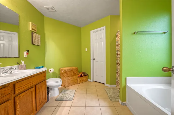 a bathroom with a sink a toilet and a bathtub