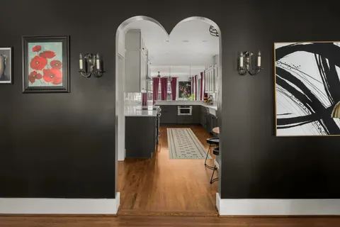 a room with wooden floor and a window