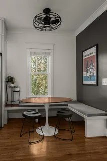a kitchen with granite countertop a sink stove and cabinets