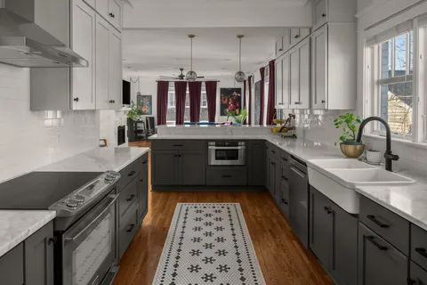a kitchen with wooden cabinets and sink