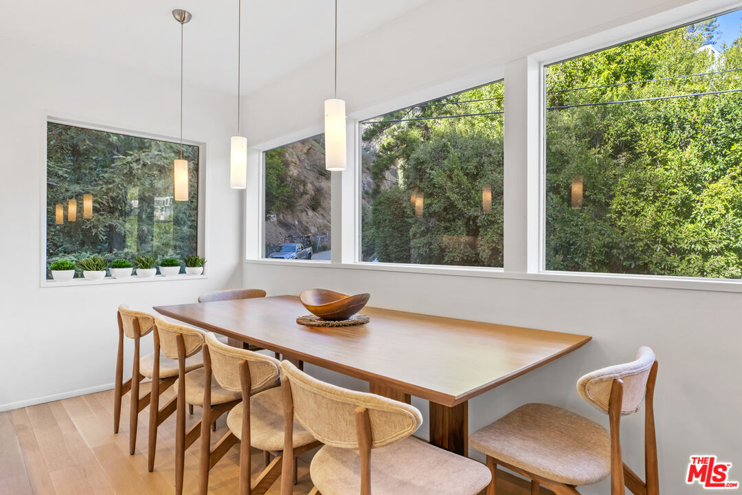 9271 Flicker Way Los Angeles, CA 90069 - Photo 12 of 28 a view of a dining room with furniture window and outside view