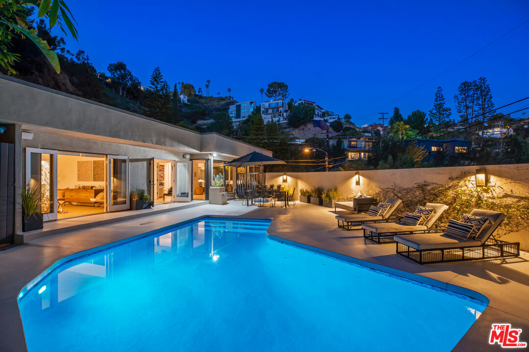 9271 Flicker Way Los Angeles, CA 90069 - Photo 2 of 28 a view of a swimming pool with outdoor seating
