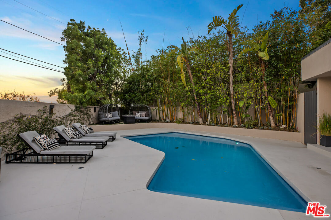 9271 Flicker Way Los Angeles, CA 90069 - Photo 25 of 28 a view of swimming pool with seating space