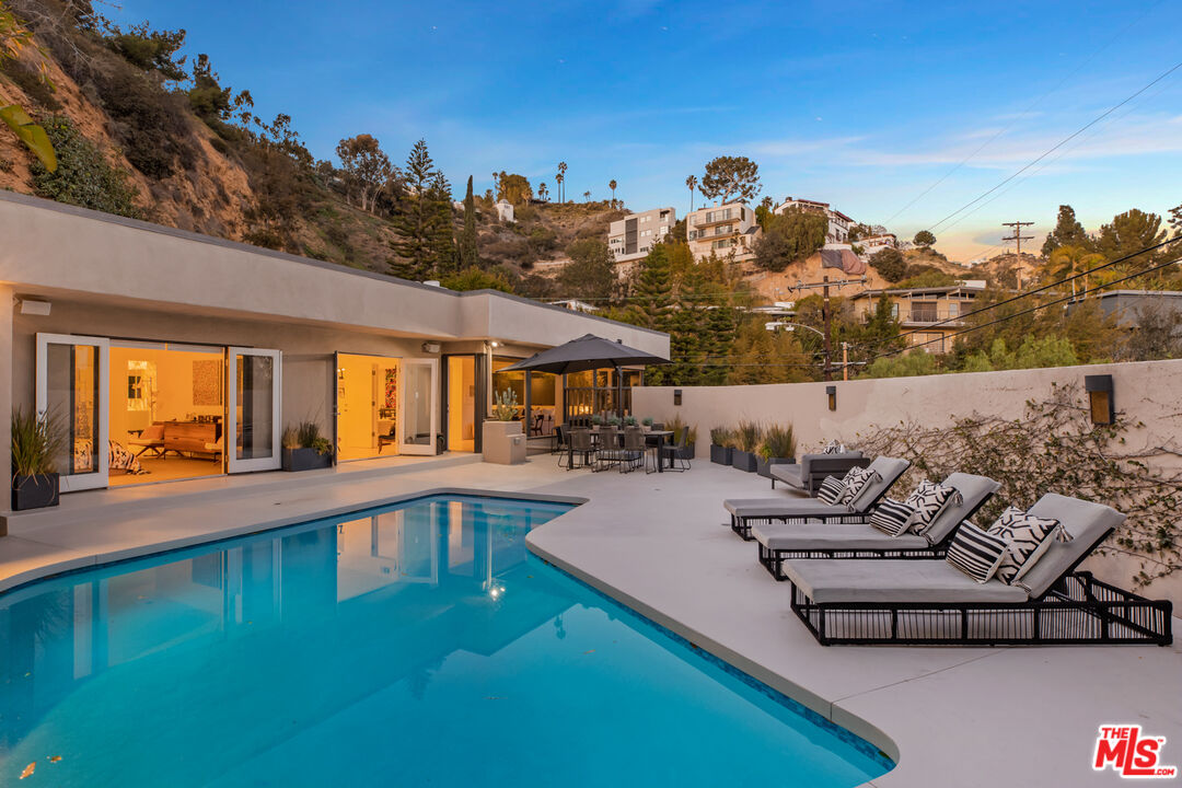 9271 Flicker Way Los Angeles, CA 90069 - Photo 26 of 28 a view of a swimming pool with lounge chair