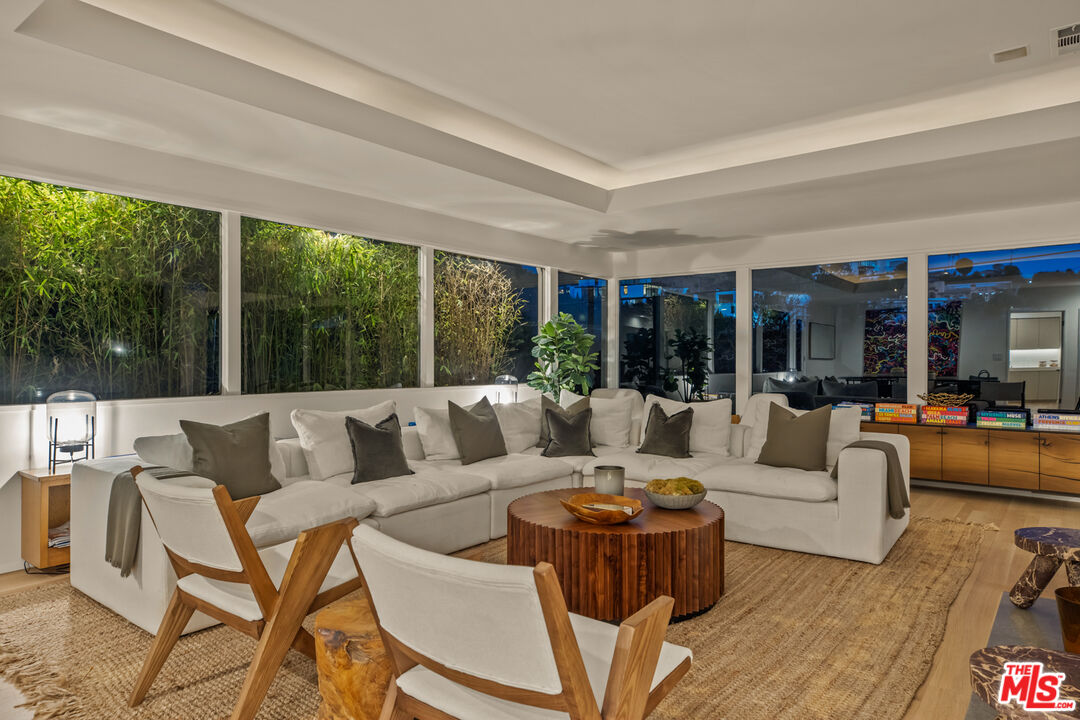 9271 Flicker Way Los Angeles, CA 90069 - Photo 27 of 28 a living room with couch and a large window