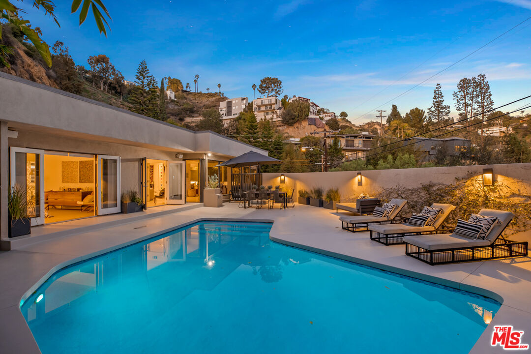 9271 Flicker Way Los Angeles, CA 90069 - Photo 28 of 28 a view of a swimming pool and lounge chair