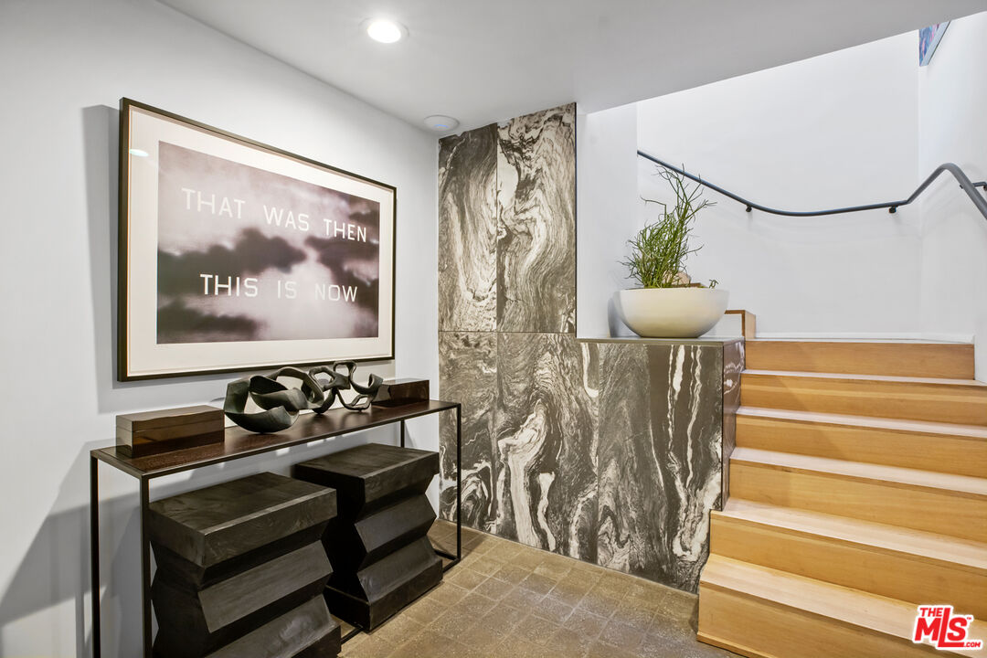 9271 Flicker Way Los Angeles, CA 90069 - Photo 5 of 28 a bedroom with furniture and wooden floor