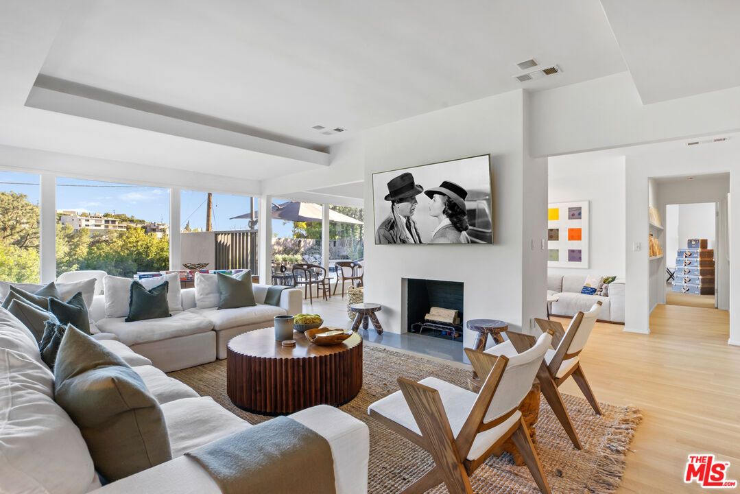 9271 Flicker Way Los Angeles, CA 90069 - Photo 7 of 28 a living room with furniture and a fireplace