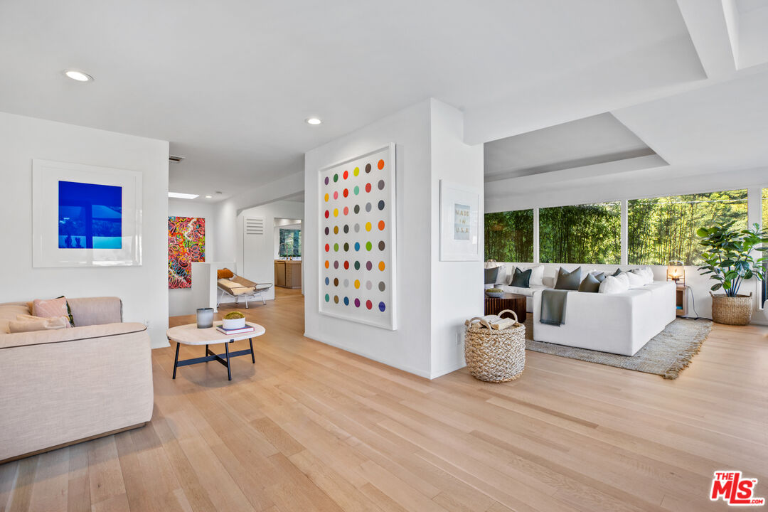 9271 Flicker Way Los Angeles, CA 90069 - Photo 10 of 28 a living room with furniture and large windows