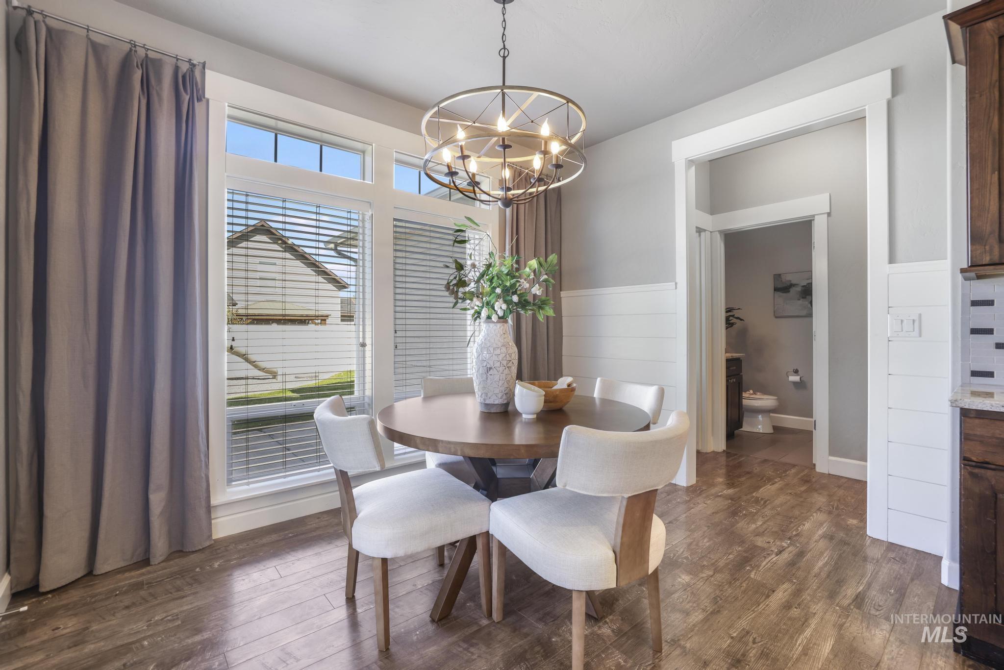 2858 Sunray Loop Twin Falls, ID 83301 - Photo 15 of 45 Dining area with dark wood-type flooring and a chandelier