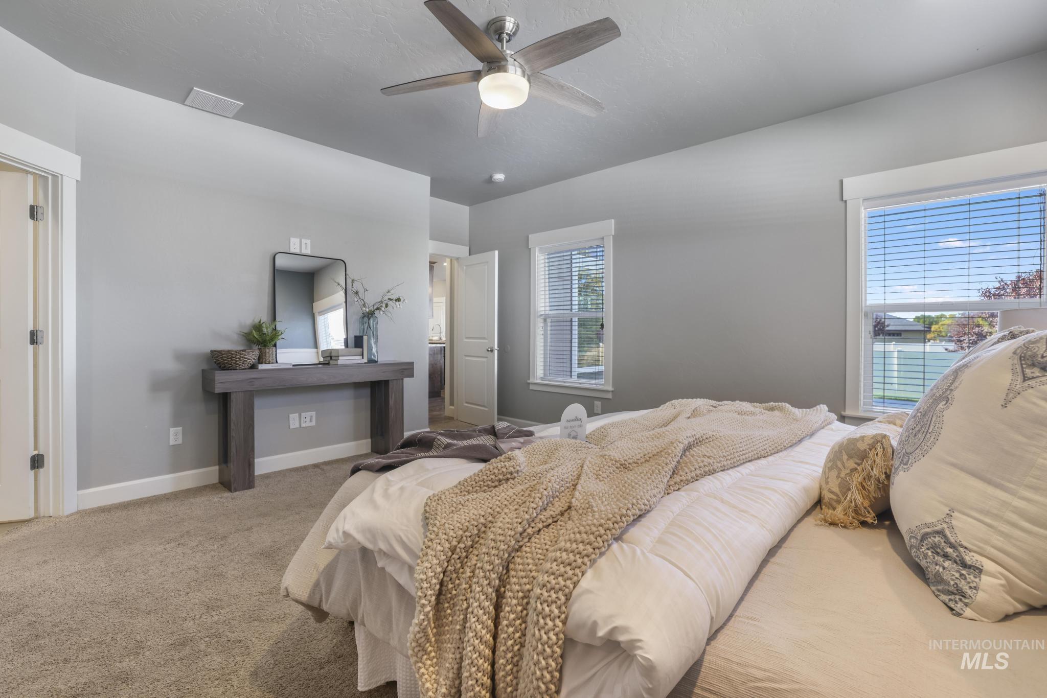 2858 Sunray Loop Twin Falls, ID 83301 - Photo 17 of 45 Bedroom featuring carpet flooring and a ceiling fan