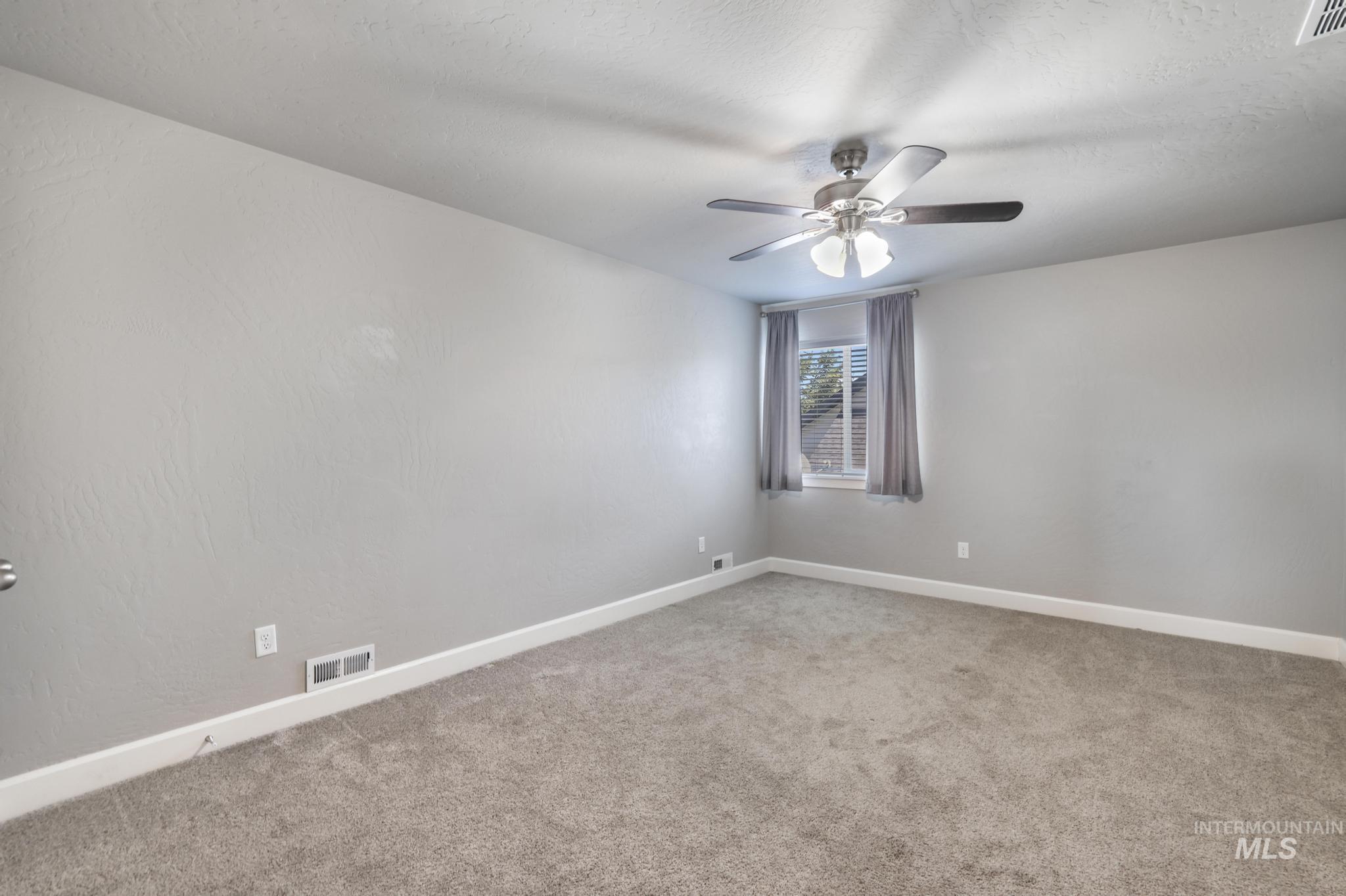 2858 Sunray Loop Twin Falls, ID 83301 - Photo 35 of 45 Spare room featuring light colored carpet and a textured ceiling